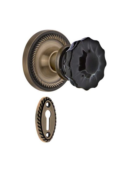 Rope Rosette Mortise Lock Set with Colored Fluted Crystal Glass Knobs Black in Antique Brass.